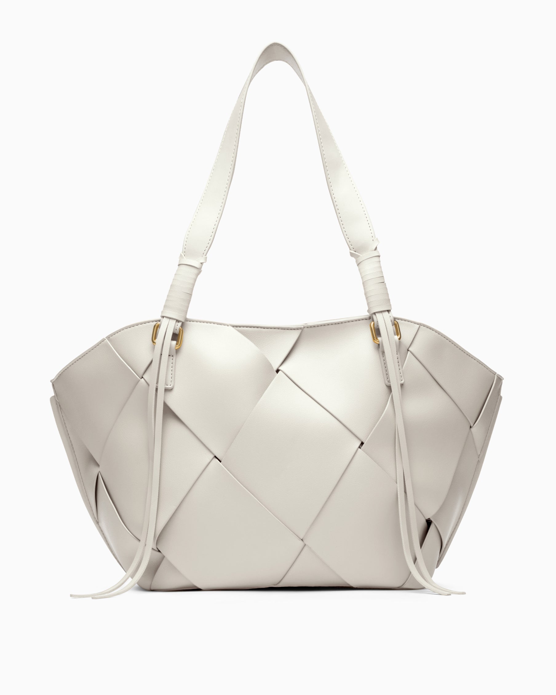 Noa vegan leather shoulder bag in white by House of Kiyaara, shown in a work or evening lifestyle setting demonstrating how a structured white shoulder bag transitions seamlessly from day to evening